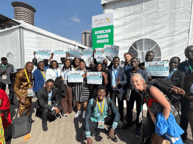 Group of African entrepreneurs and leaders at climate change event, showcasing innovative home-grown.