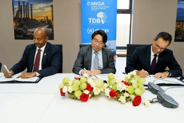 Representatives from TDB, MIGA, and OCP Group sign partnership agreement in Africa.