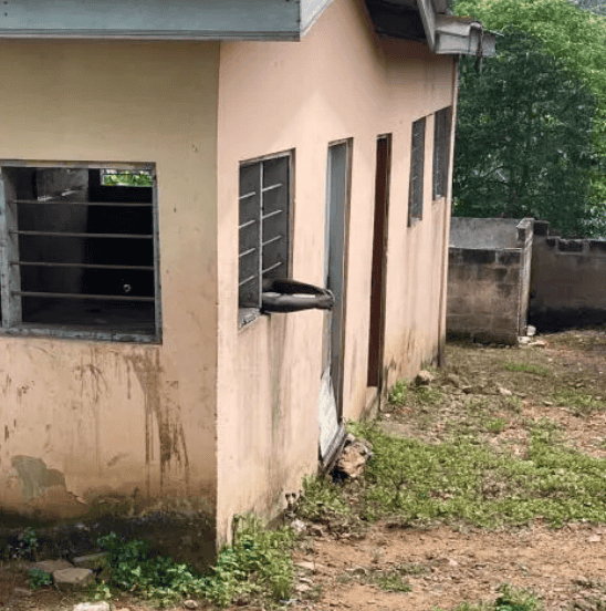 Image showing a modest house with open windows and a small yard in Ghana.