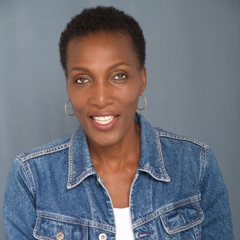 African woman smiling, representing the importance of the African diaspora today.