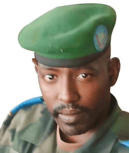Military officer wearing green beret, looking serious in uniform.