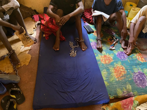 Community members discussing mental health issues in Kenya.