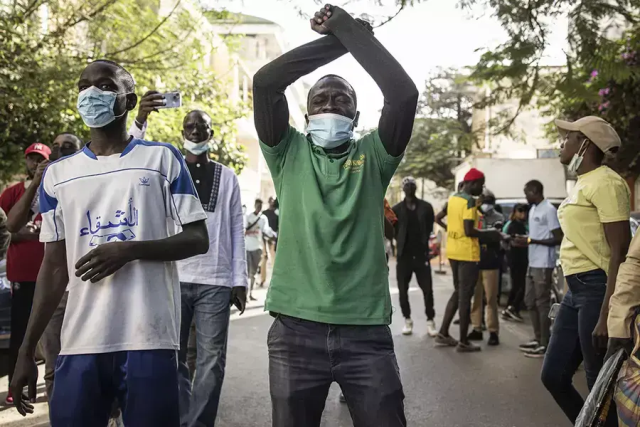 Senegalese protesters wearing masks during a demonstration for democracy.