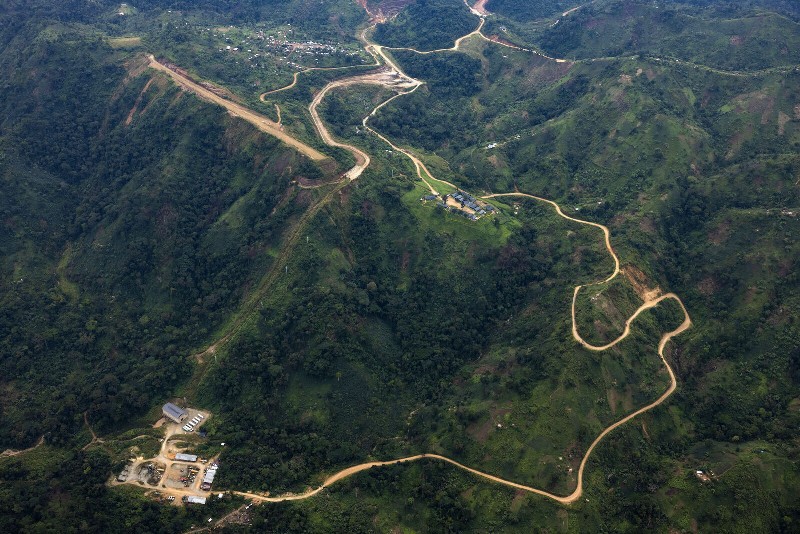 Mountain road winding through lush Virunga National Park, Congo.