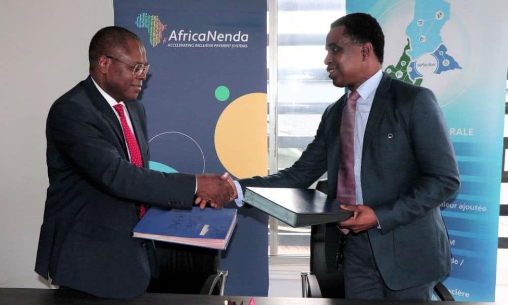 Two men shaking hands at AfricaNenda and GIMAC financial inclusion workshop.
