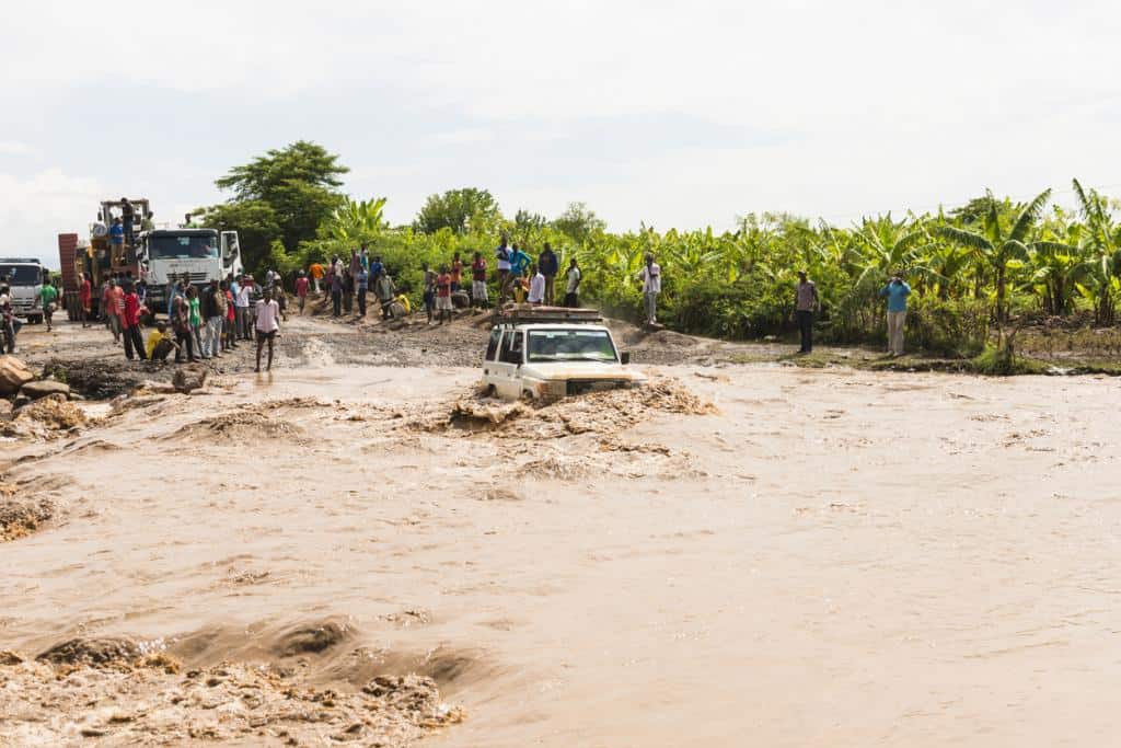 Flooded roads and stranded vehicles during heavy rains in East Africa.
