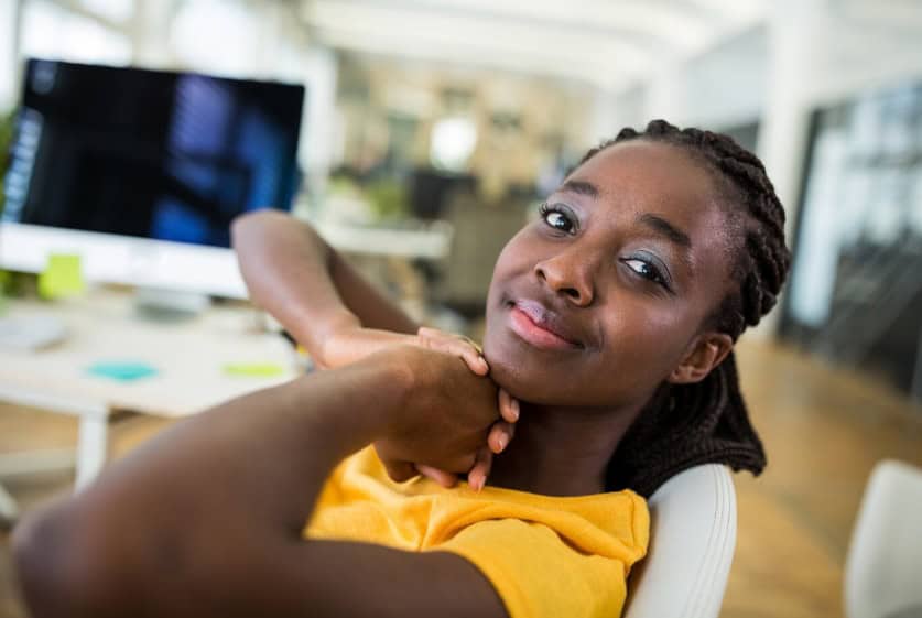 Young African girl exploring technology and innovation.
