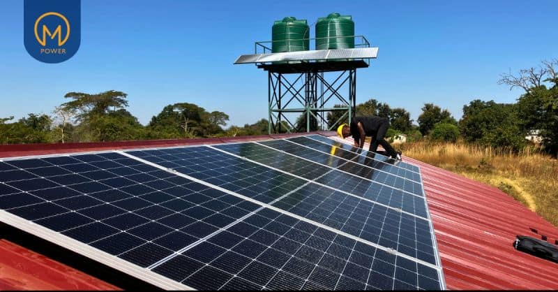 Solar panels powering rural communities in Zambia for sustainable energy access.