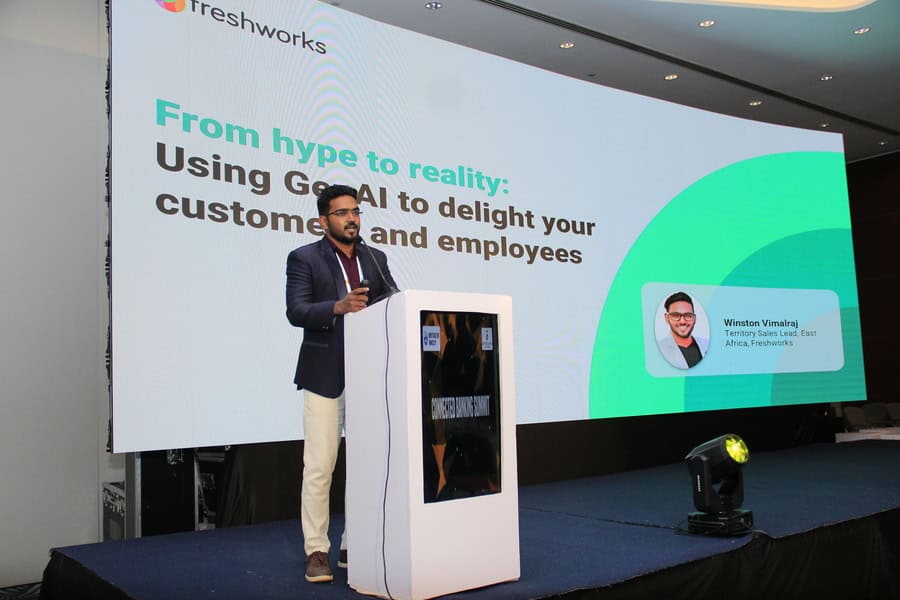 An expert speaker presents on transforming banking with AI and customer-centric strategies at the su.