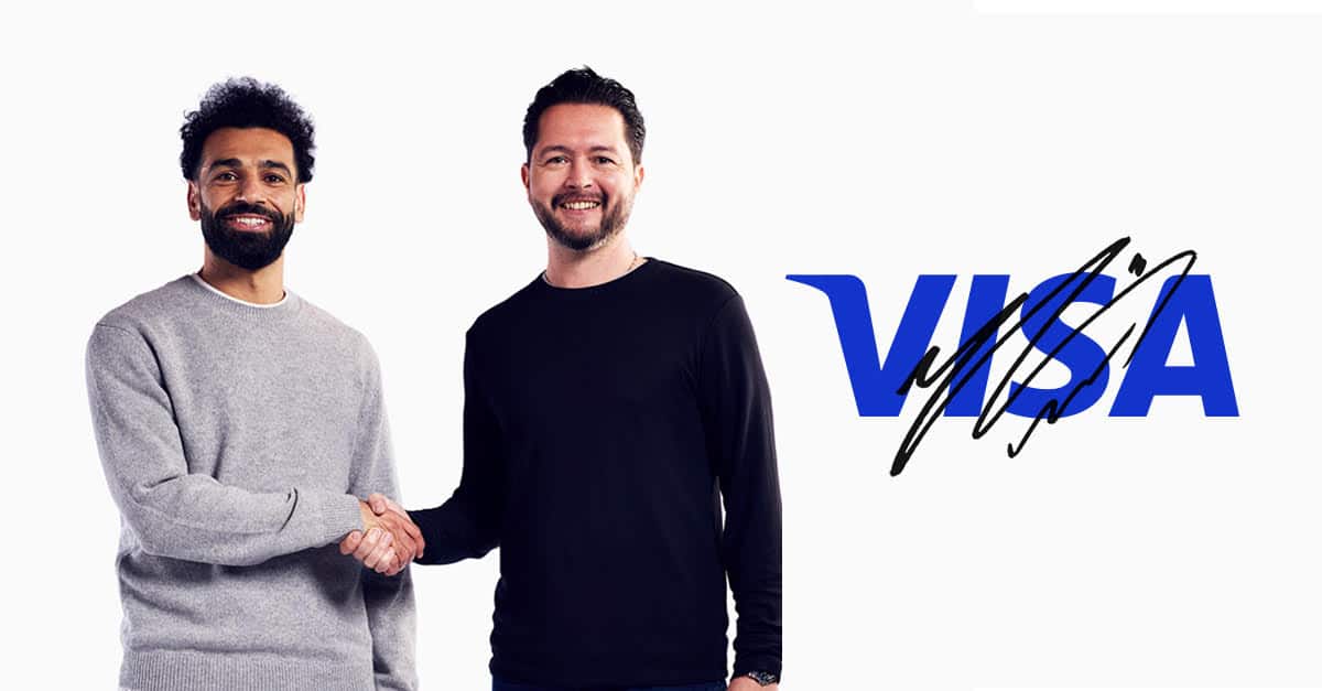 Mo Salah and a partner shaking hands for Visa Africa partnership.