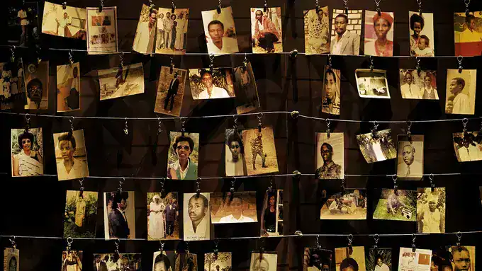 Photos of Rwanda genocide victims displayed in a memorial exhibit.