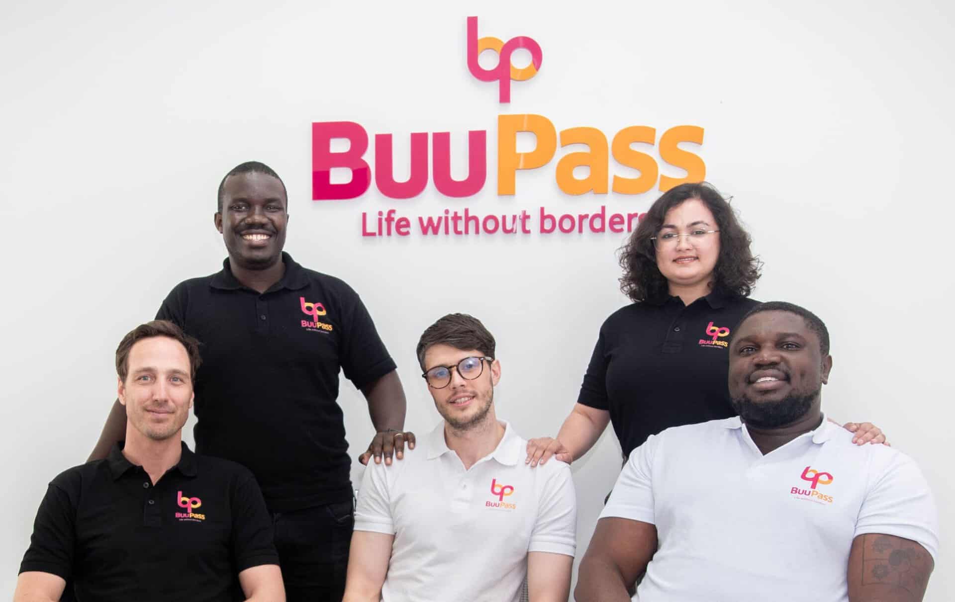 BuuPass team members smiling in front of company logo, celebrating Africa's largest intercity transp.