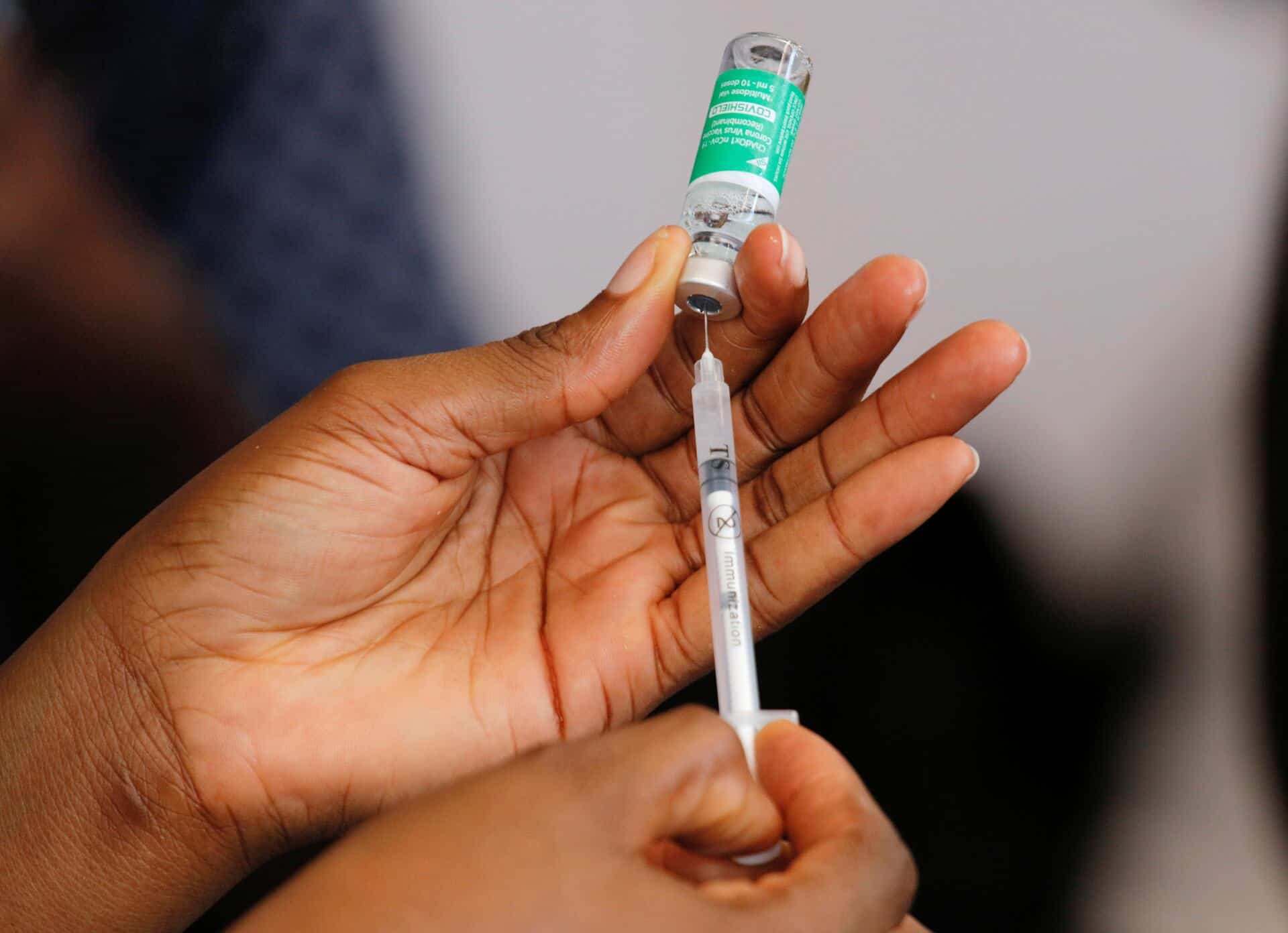 Person receiving a COVID-19 vaccine injection in their arm.