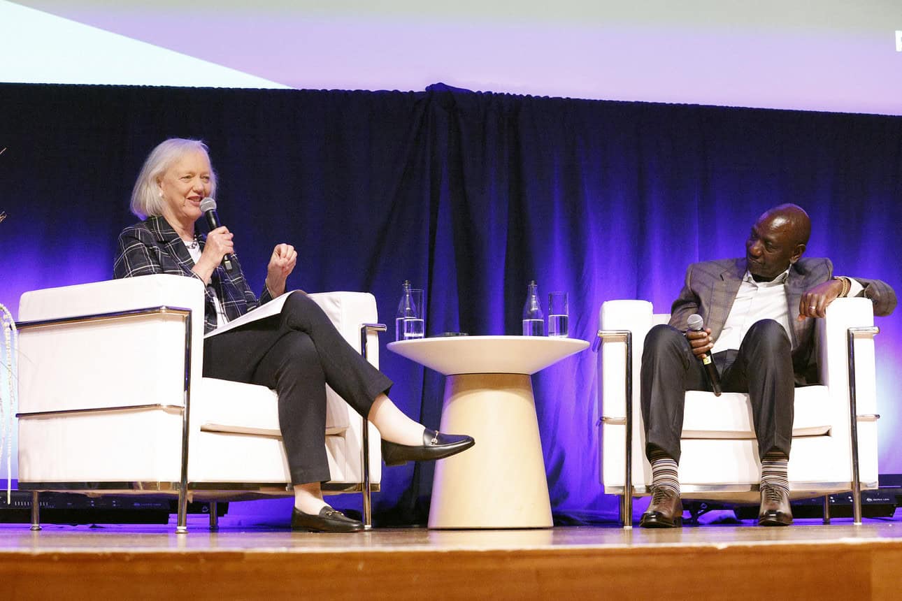 Two women speaking on stage at a tech conference, discussing Africa's tech growth.