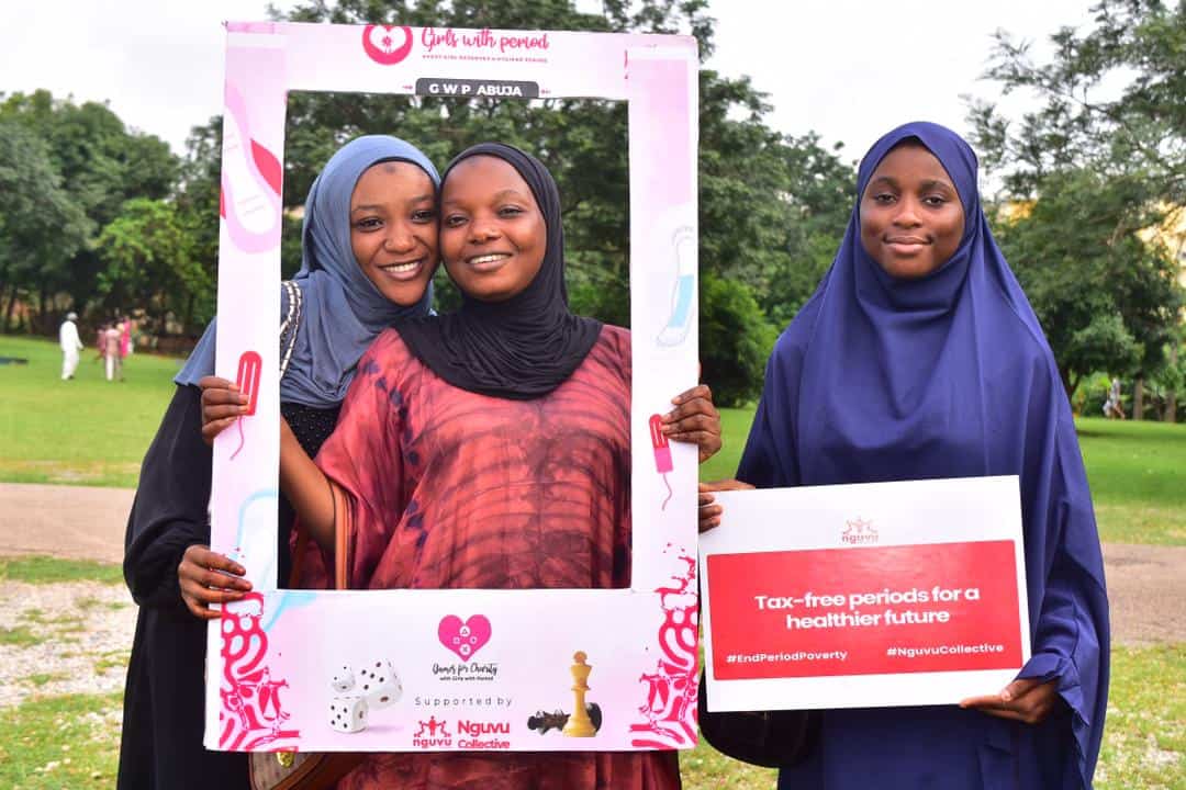 Empowered women celebrating at Africa’s Women’s Day event promoting menstrual health awareness.
