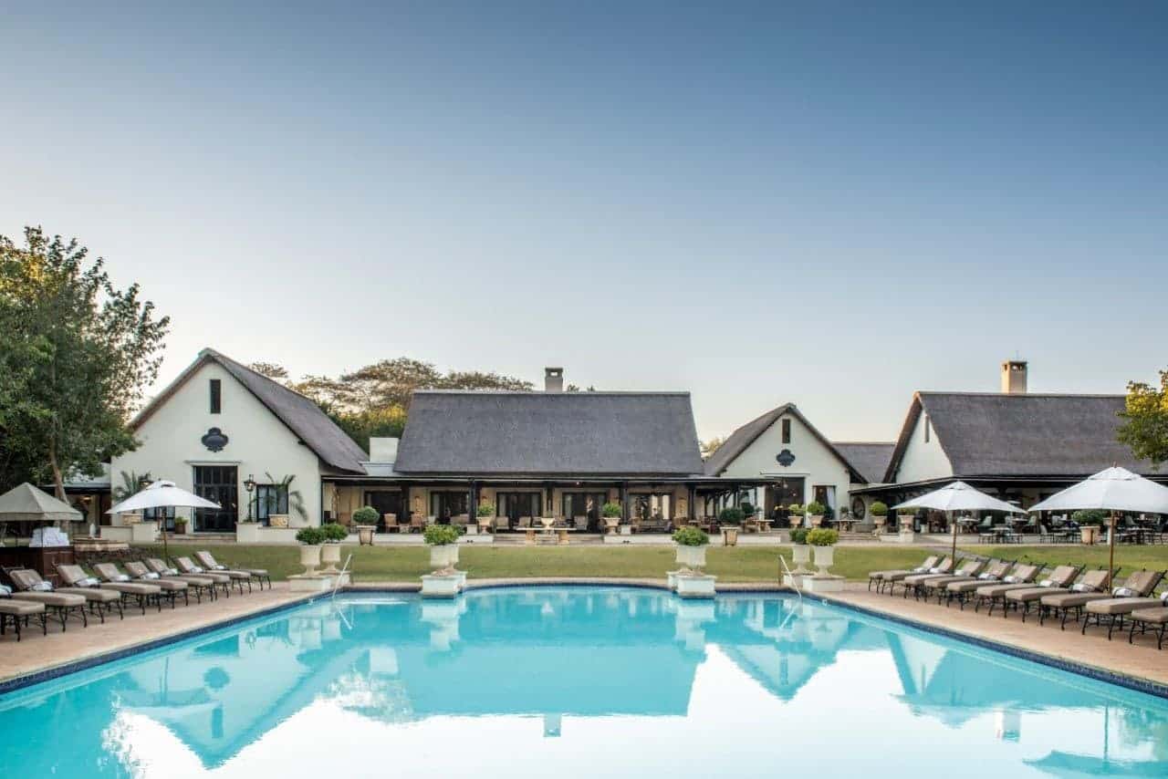 Luxury hotel pool with outdoor seating at Minor Hotels in Zambia and Mozambique.