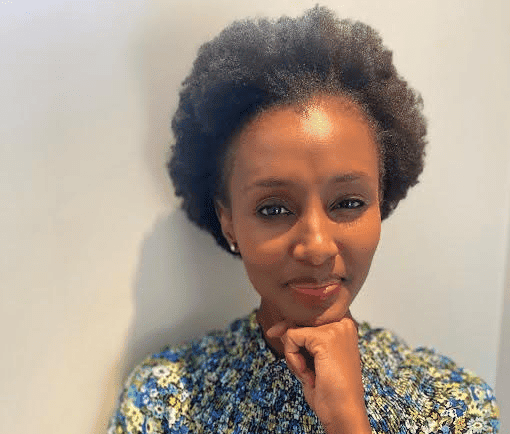 Empowered African woman advocating for mentorship in board and senior leadership roles.