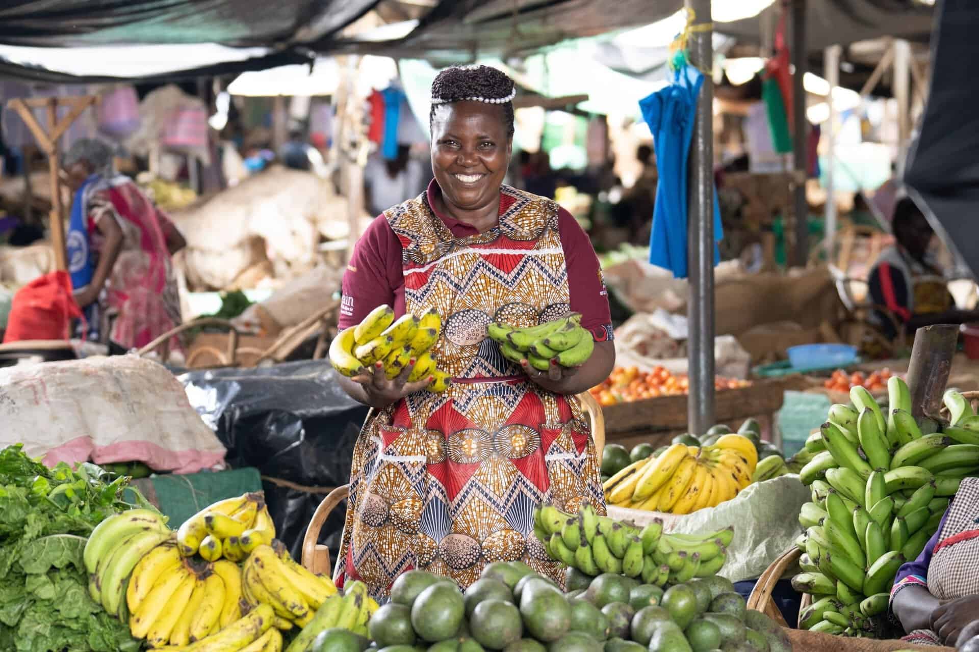 Fresh bananas and vegetables at an outdoor market in Africa.