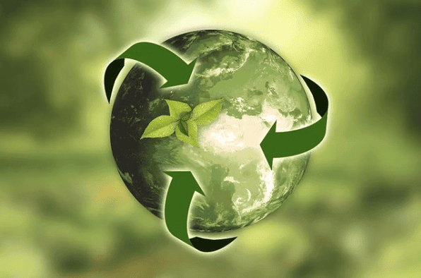 Earth with green leaves and recycling arrows emphasizing sustainability.