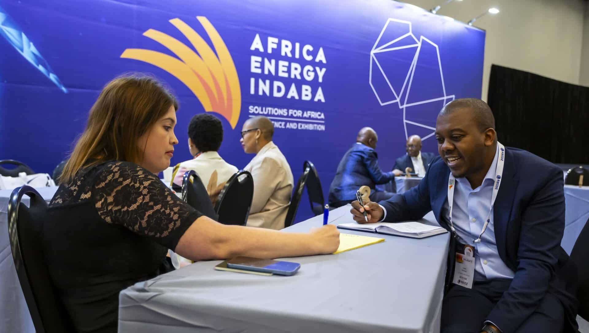 Business professionals discussing energy solutions at Africa Energy Indaba.