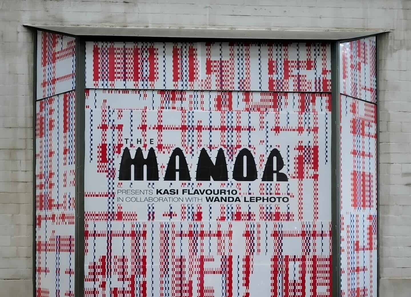 Modern concept store entrance with vibrant red and white patterns in Africa.
