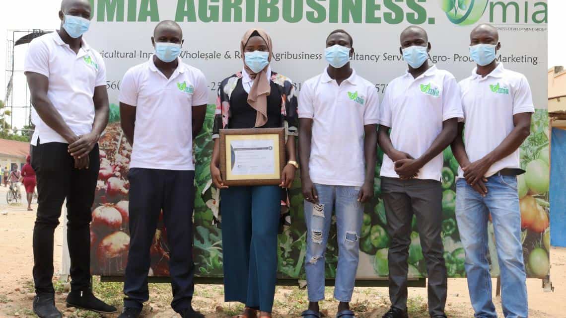 Ugandan farmers receive recognition at a sustainable agriculture event, promoting empowerment and gr.
