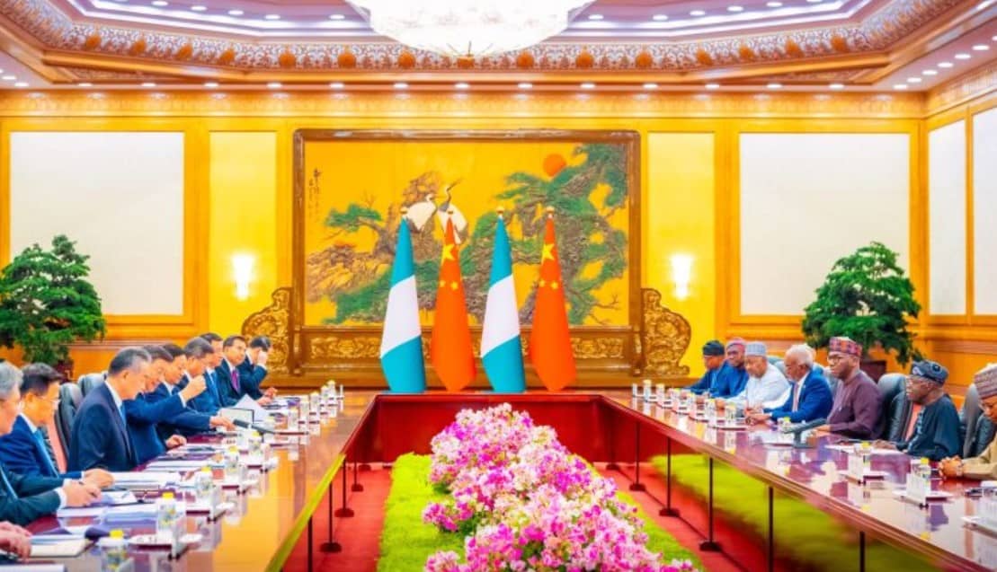 AFCON 2025 group draw in Morocco with officials and flags.