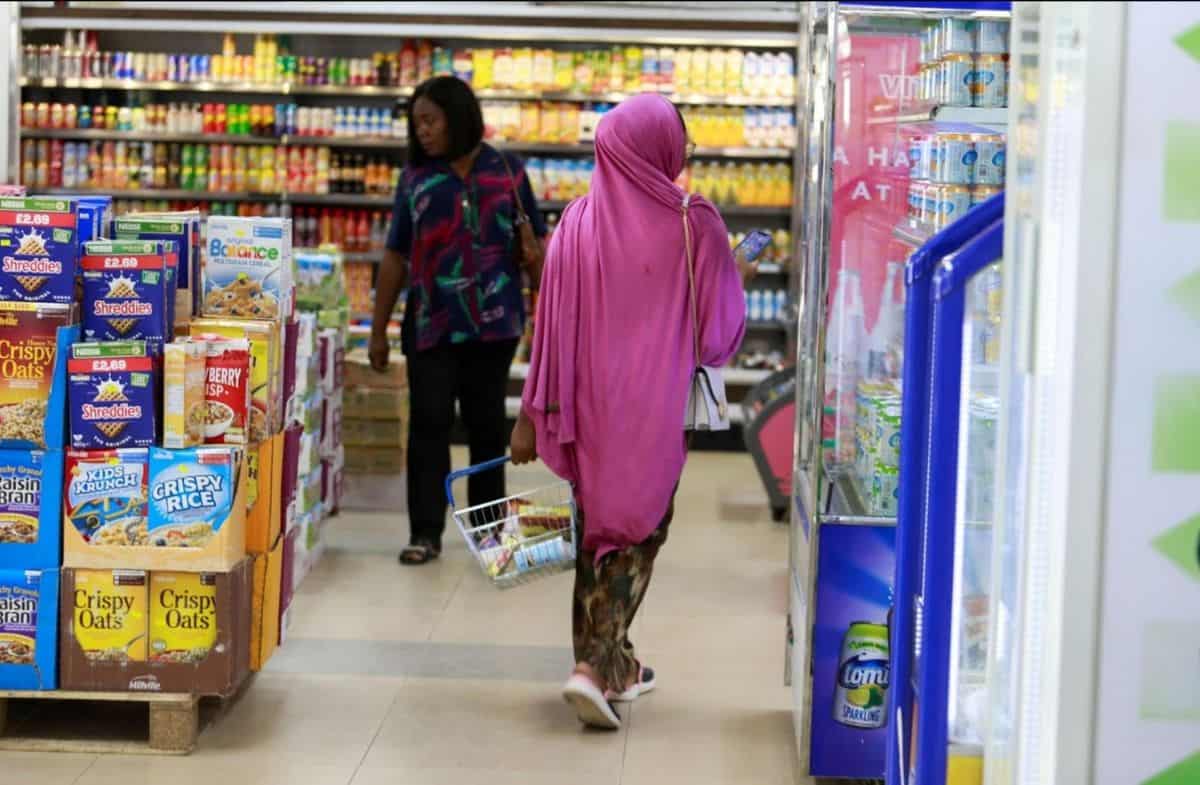 Ethiopian female athlete shopping in a supermarket after winning at the 2025 Dubai Marathon.