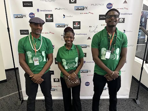 Three filmmakers from Ghana pose at the awards event for their sci-fi film "The B.A.T.U. Project: AD.