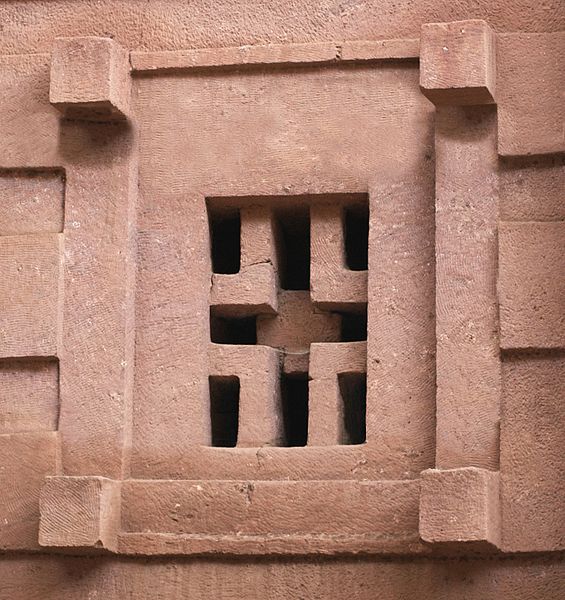 Close-up of traditional African stone carving with geometric patterns.