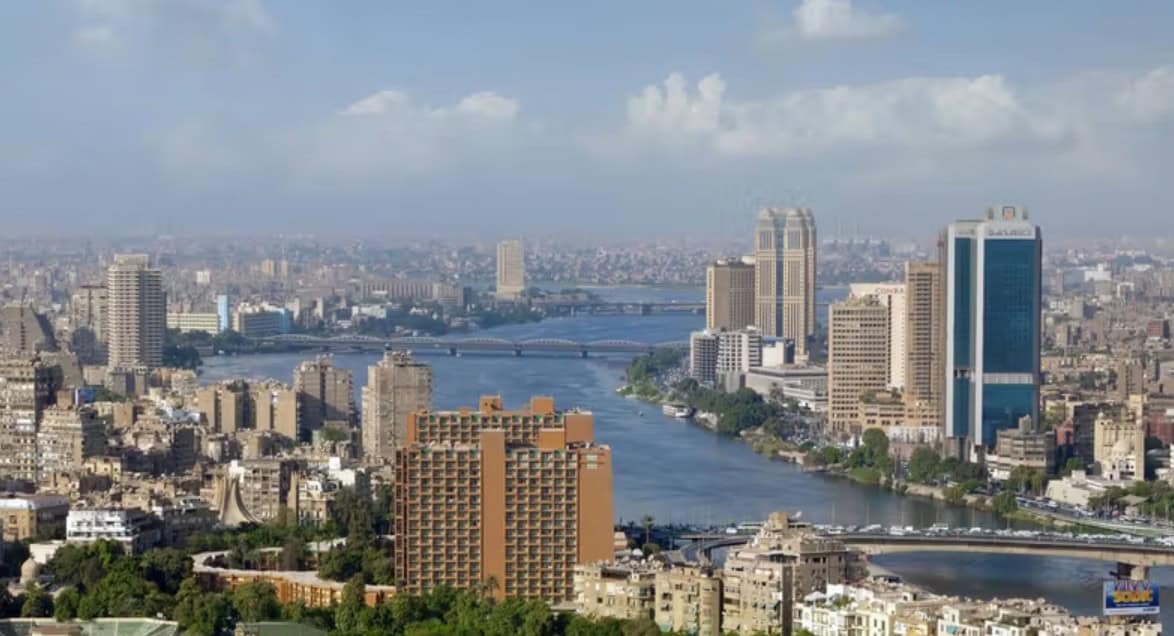 Panoramic view of Kampala city skyline along the Nile River in Uganda.