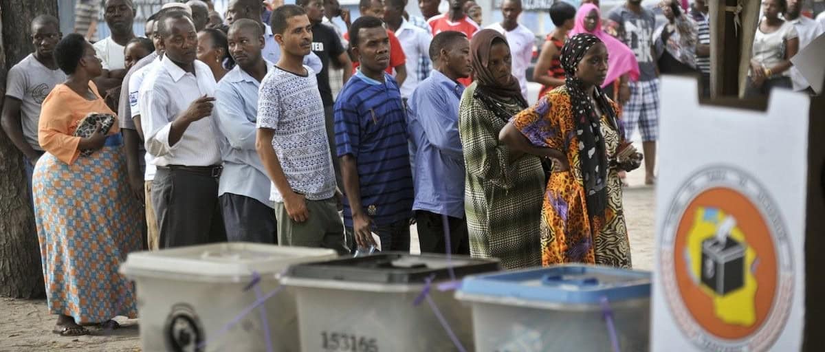 Voters wait in line at a polling station during Tanzania’s election process.