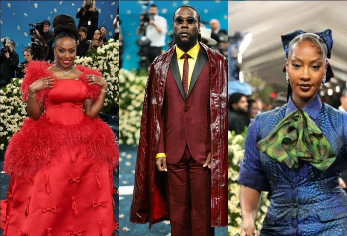 African fashion models in vibrant traditional and modern attire at a cultural celebration.