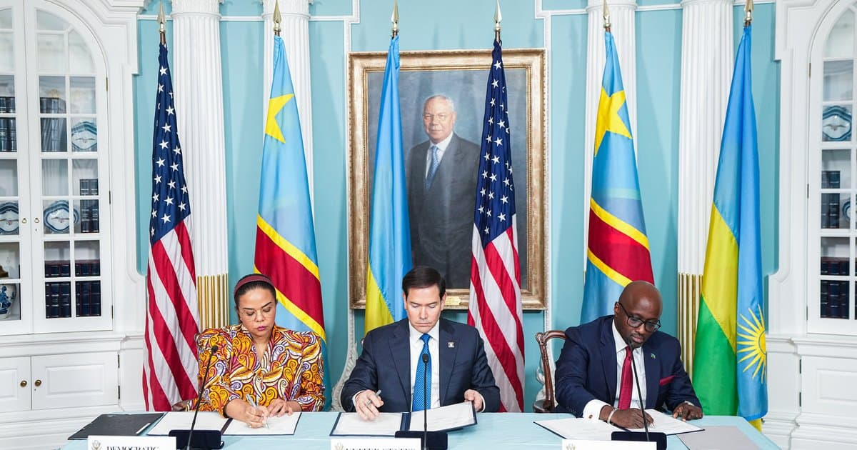 African leaders and US officials at peace talks with flags in background.