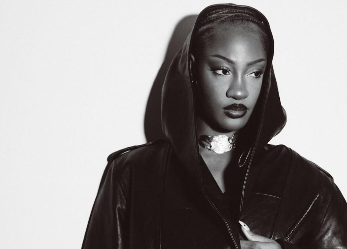 African woman artist Tems wearing a hoodie, symbolizing empowerment in Africa’s music industry.