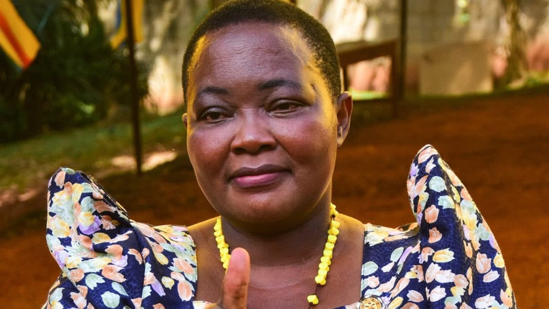 Women land rights advocate speaking at land governance event in Africa.