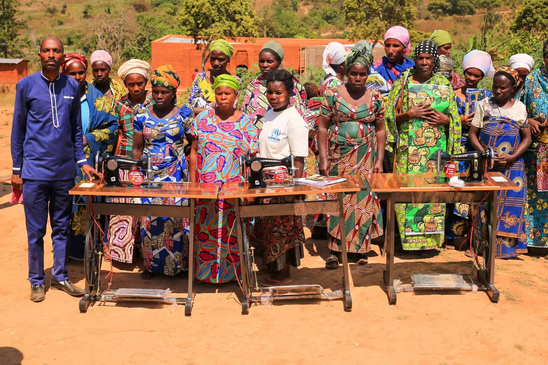 Women in Africa learning sewing skills for empowerment and economic growth.