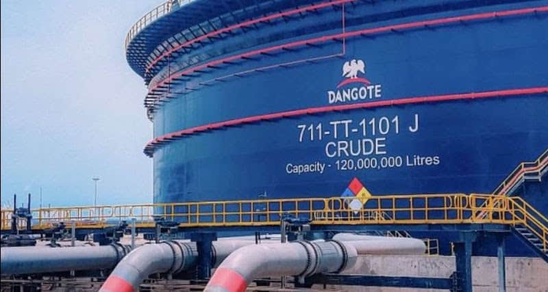 Oil storage tank at Dangote refinery with capacity details visible.