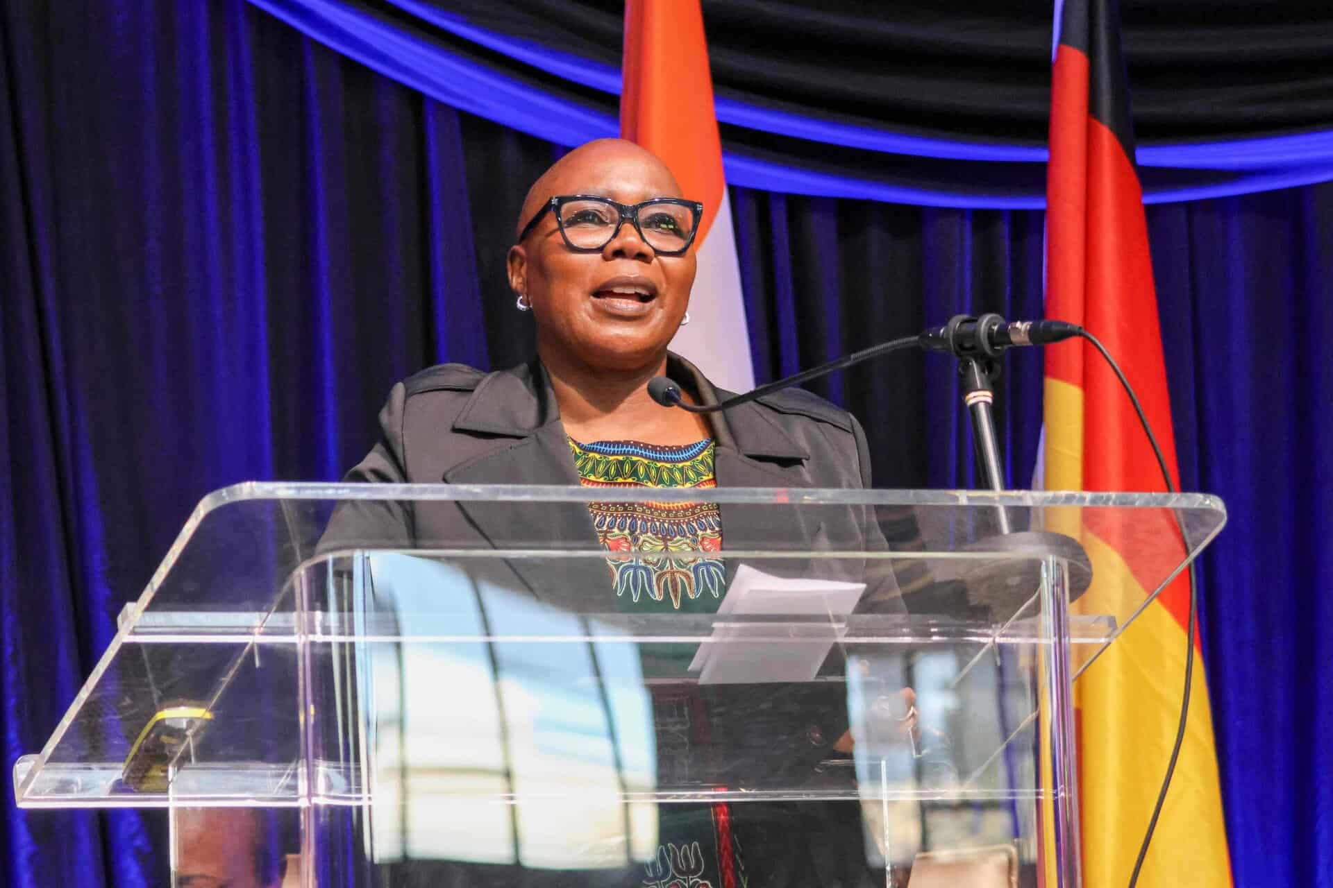 South African woman speaking at a conference on disability technology and innovation.