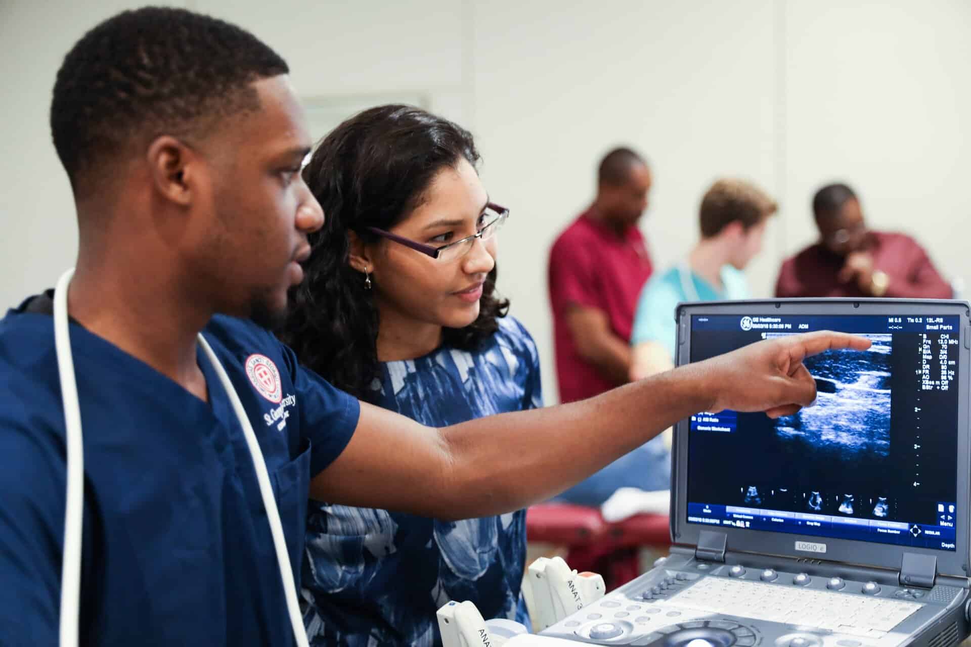 Medical students studying ultrasound diagnostics for medical abroad programs.