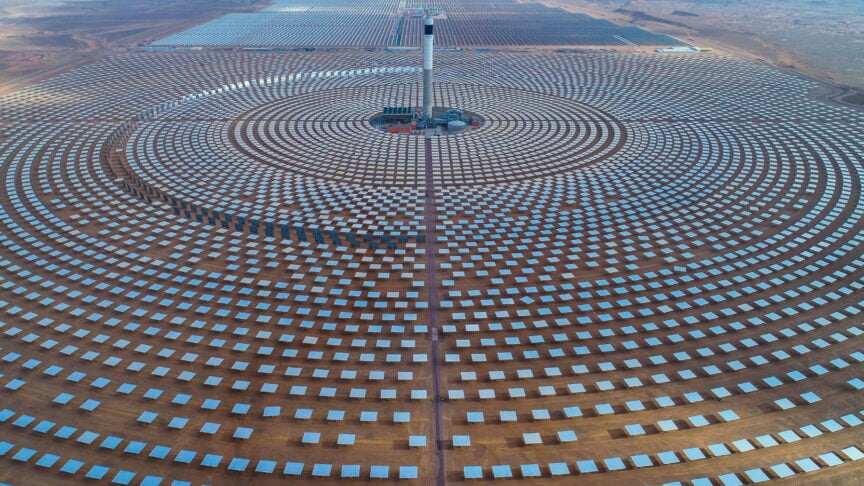 Solar power plant with circular solar panels promoting renewable energy in Africa.