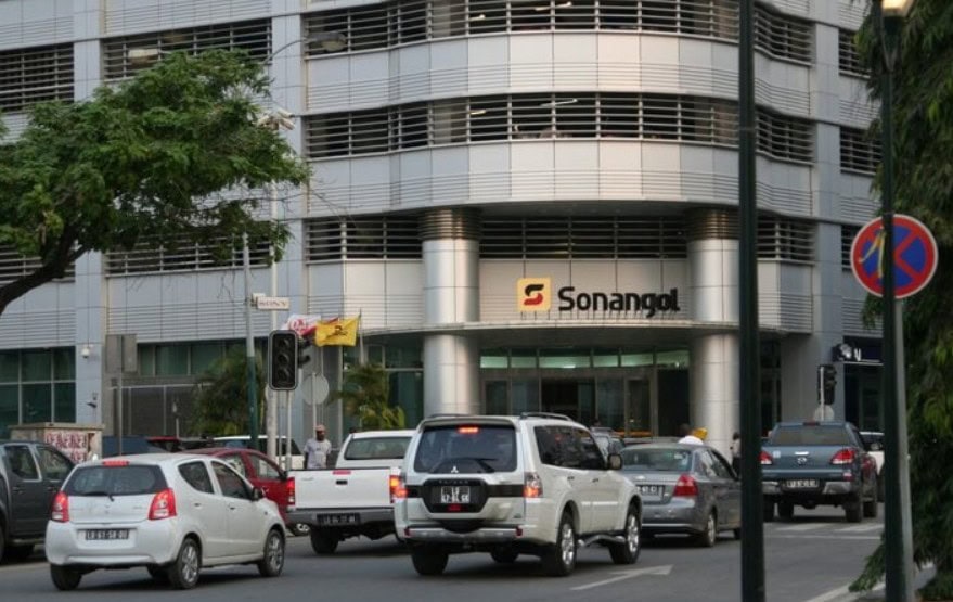 Modern office building with vehicles in busy city street, highlighting Africa’s expanding tourism in.