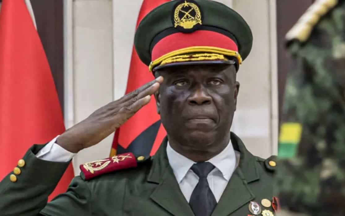 Ghana military officer in uniform salutes during a formal event.