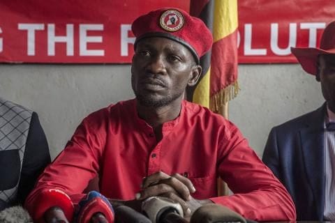 Ugandan political activist at opposition rally after post-election violence.
