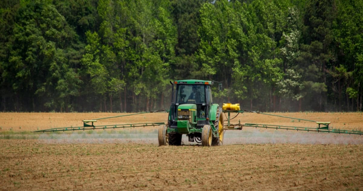 Agricultural tractor spraying crops at Agritec Africa 2026.