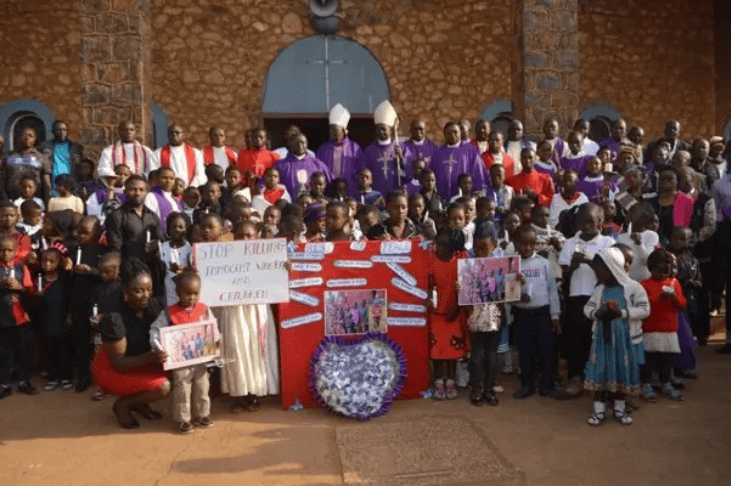 Group of people protesting for justice in a massacre trial in Cameroon.