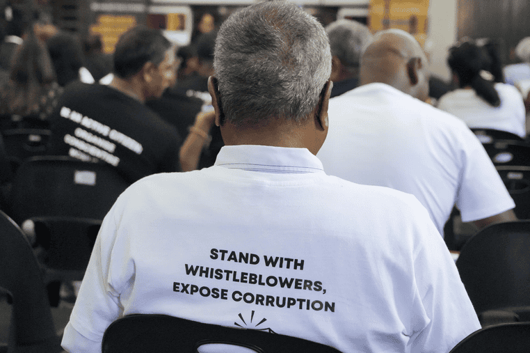 South African whistleblowers at rally advocating against corruption.