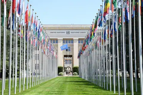 United Nations building with flags of member countries in New York.