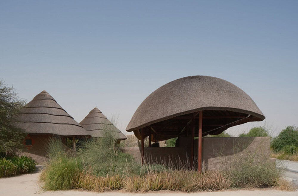 Unique African-style architecture shapes a modern nature park in the UAE.
