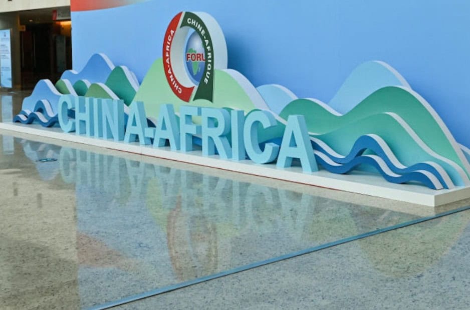 China-Africa cooperation sign with mountains and waves background.